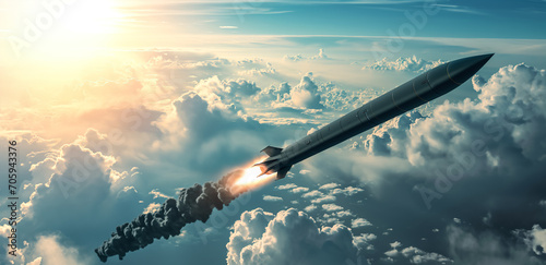 Hypersonic missile. A combat rocket is flying above the clouds. Missile attack, air attack, war, missile strike. photo