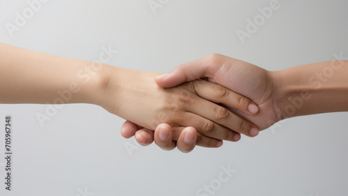 Handshake of two people, isolated on white background, closeup