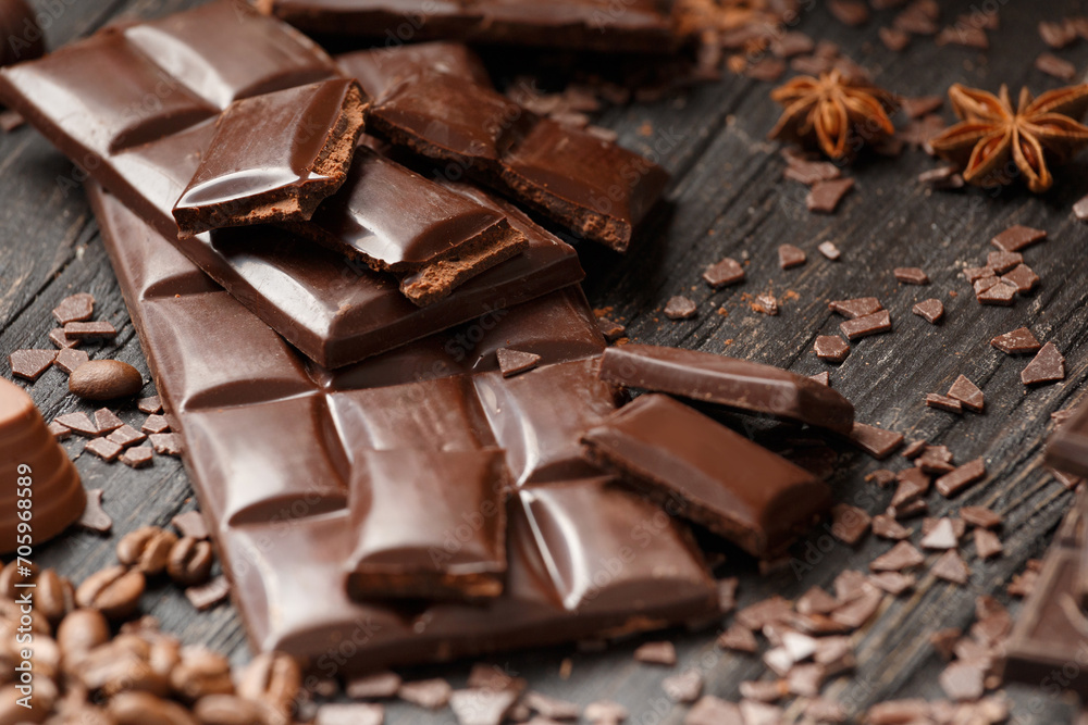 Dark chocolate and spices on wooden background Dark chocolate and spices on wooden background