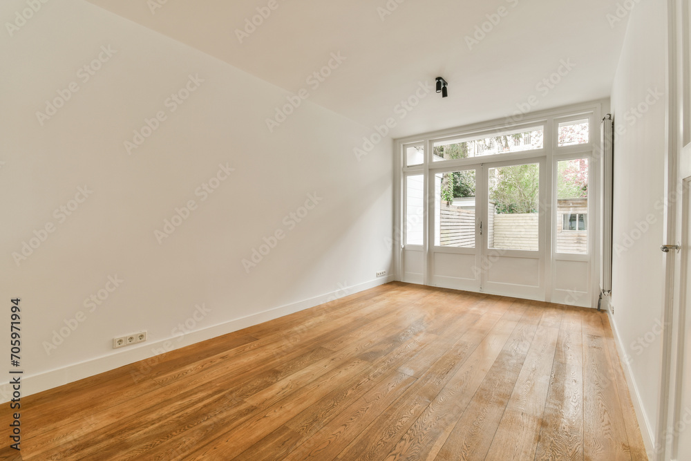 Living room with white walls and hardwood floor Living room with white walls and hardwood floor