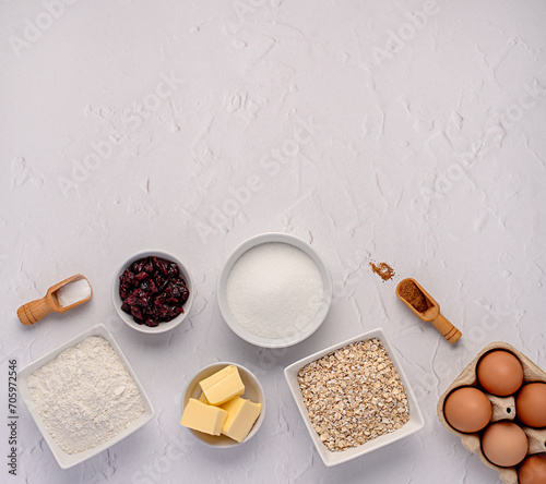 Blank food photography of raw ingredients of oat biscuits, cookie, dough, egg, sugar, white flour, butter, dried cranberry, vanilla, bake, bakery photo