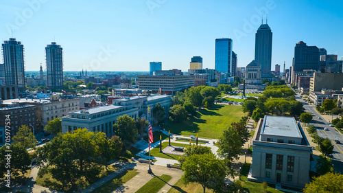 Aerial View of Indianapolis Skyline with American Flag and Green Park Spaces