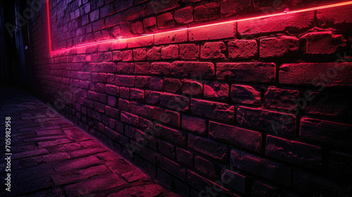 A brick wall illuminated from below with neon red light © B & G Media