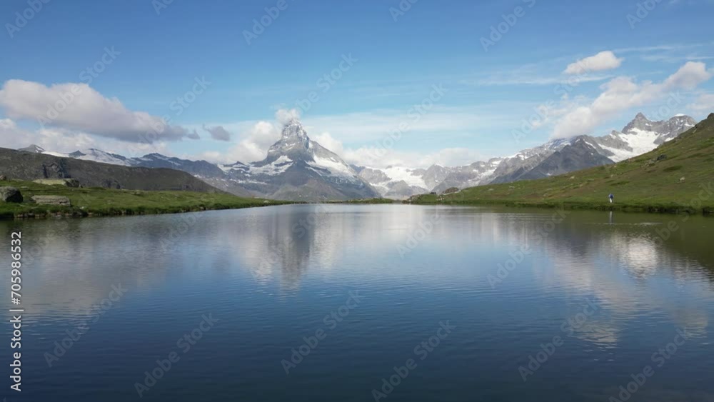Majestic mountain peak reflected in serene Stellisee lake with Matterhorn mountain Majestic mountain peak reflected in serene Stellisee lake with Matterhorn mountain