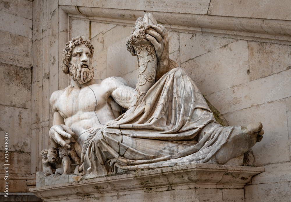 The ancient statue of Tiberinus (god of the river Tiber) holding a cornucopia (the horn of plenty). It lies in front of Palazzo Senatorio, in Piazza del Campidoglio (Capitoline square), in Rome, Italy