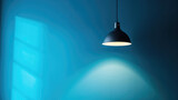 A lamp hangs against a blue wall, casting its light and illuminating the area, with space available for text or presentation.