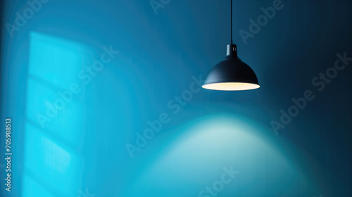 A lamp hangs against a blue wall, casting its light and illuminating the area, with space available for text or presentation.