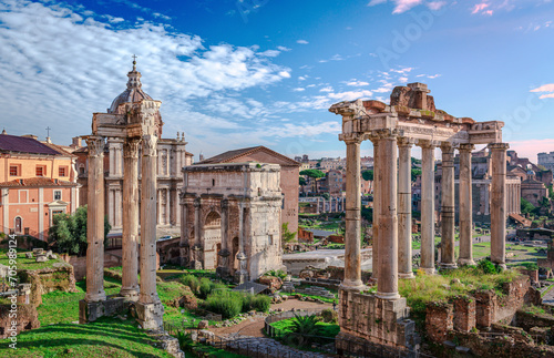 The Roman Forum, seen from Capitoline Hill. It is a rectangular forum surrounded by the ruins of several important ancient government buildings at the center of the city of Rome. photo