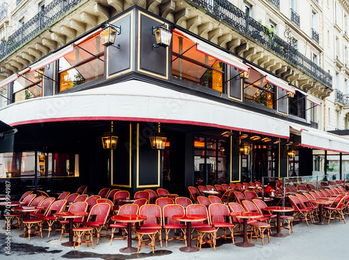 Cozy street with tables of cafe in Paris, France. Architecture and landmark of Paris. Cozy Paris cityscape