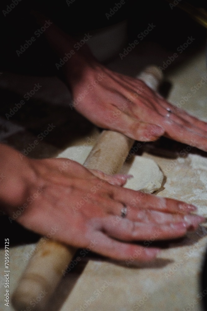 hands of a person cooking meal