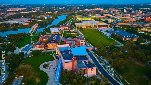 Aerial Golden Hour over University Campus with River and Green Space