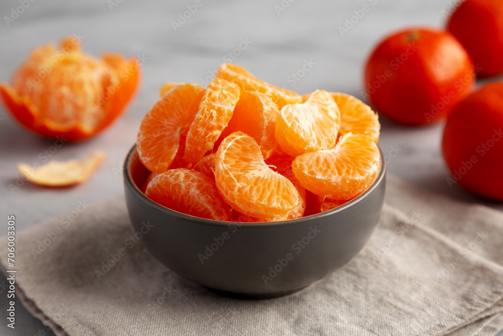 Organic Peeled Mandarin Oranges in a Bowl, side view. Organic Peeled Mandarin Oranges in a Bowl, side view.