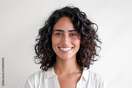 Radiant portrait of a Latino woman  glowing with positivity  white background