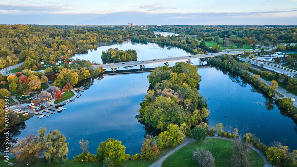 Fototapeta premium Aerial Autumn Riverside with Bridge and Marina in Michigan