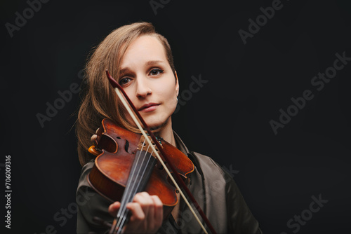 Passionate young violinist immersed in her music