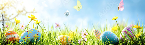 colourful easter eggs on colorful grass with bokeh background