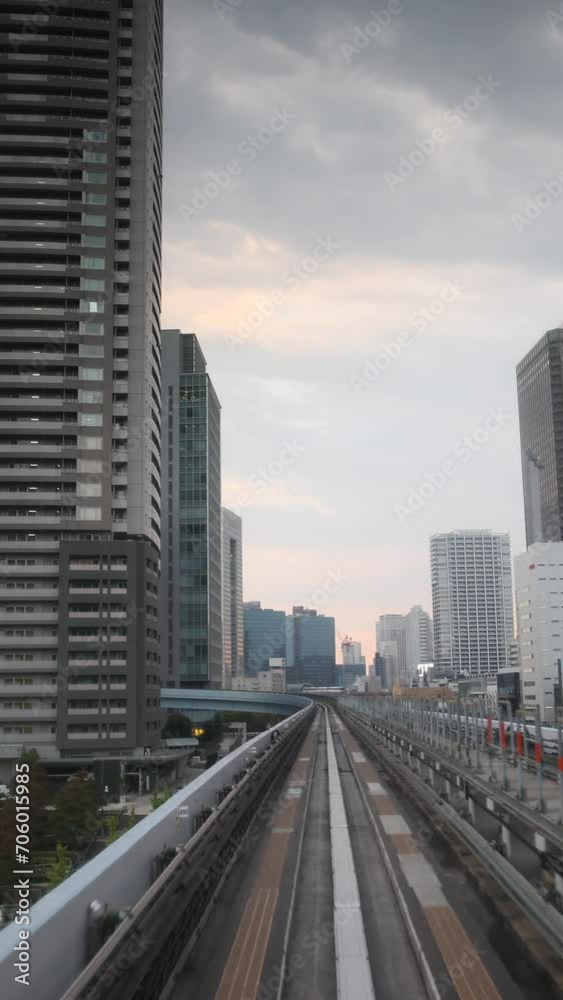 tokyo monorail passing through the city's skyscapers in vertical tokyo monorail passing through the city's skyscapers in vertical