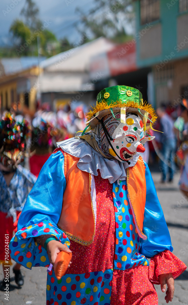 People with devil masks dancing at the Diablada Pillarena, a traditional festival of Ecuador