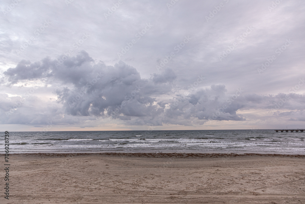 dark clouds at the sandy beach in Galveston,  USA