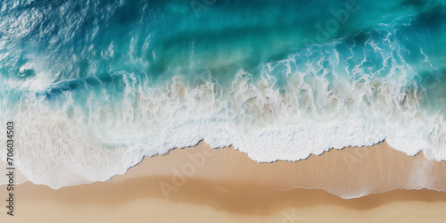 Coast, waves rolling onto the sand, view from above