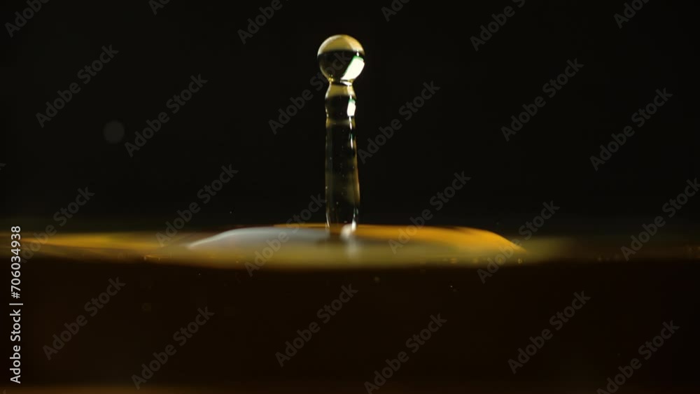 Cosmetics golden serum liquid. Falling drop macro abstract background. Cosmetic moisturizer essence gel. Collagen fluid bubble molecule. Yellow moisturizing cream oil. Beauty skin health care concept