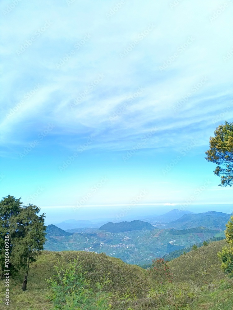 View of the mountains from above with beautiful sunlight and gathering clouds. View of the hills taken from a height with beautiful sunlight and clouds. View of the mountains from above with beautiful sunlight and gathering clouds. View of the hills taken from a height with beautiful sunlight and clouds.