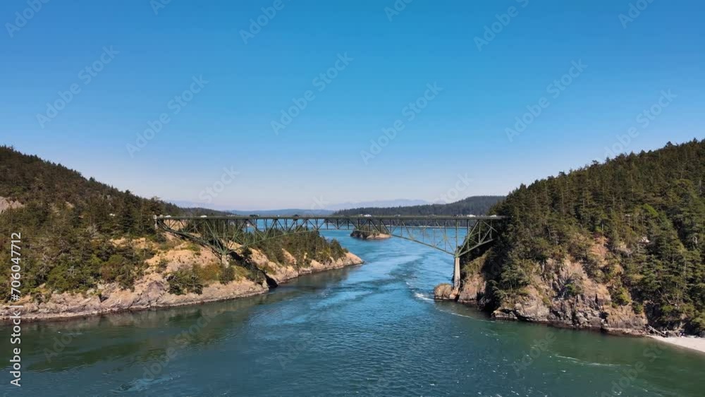 Aerial rising shot of vehicles crossing the Deception Pass in Washington Aerial rising shot of vehicles crossing the Deception Pass in Washington