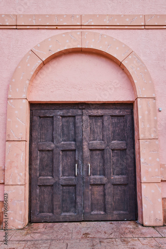 Weathered Wooden Doors in Peach Wall, Nassau © Nicholas J. Klein