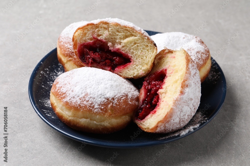 Delicious sweet buns with cherries on gray table, closeup Delicious sweet buns with cherries on gray table, closeup