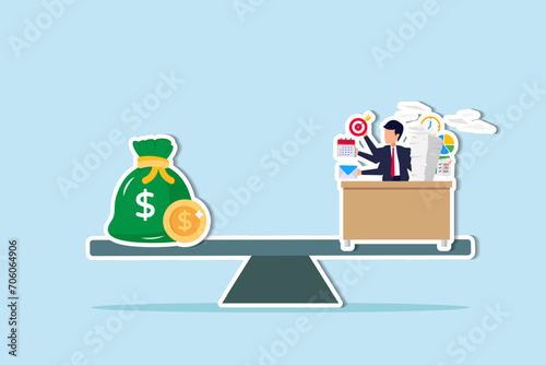 Wages, salary or income, work hard for money or incentive motivate to work overtime, overworked and life balance concept, businessman working hard on busy desk seesaw balance with wages money bag.