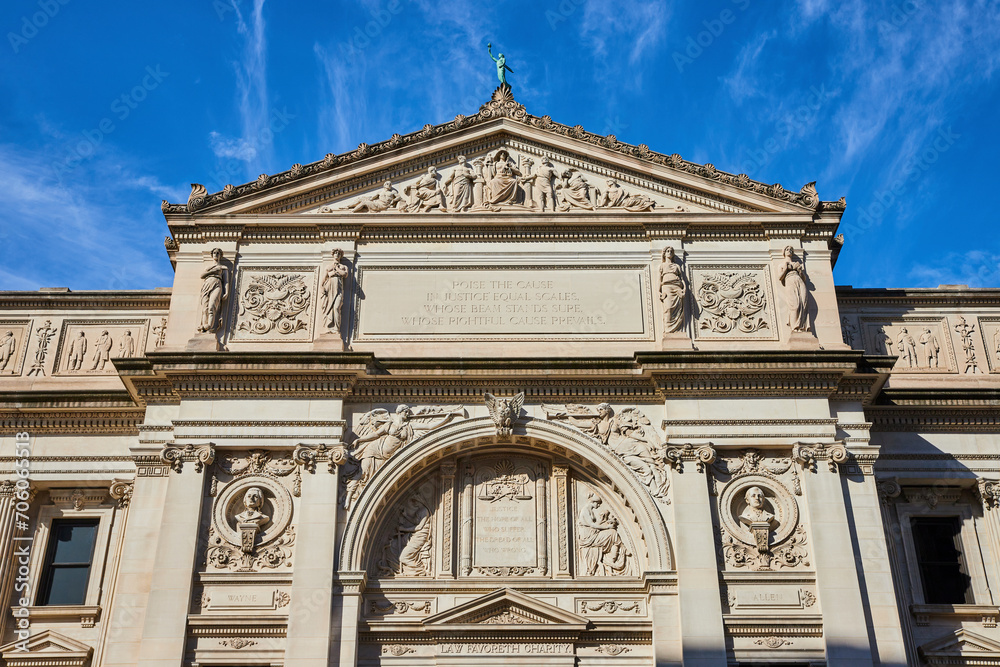 Neoclassical Courthouse Facade with Justice Inscription, Blue Sky