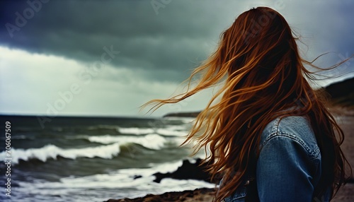 a ginger woman on the beach photo