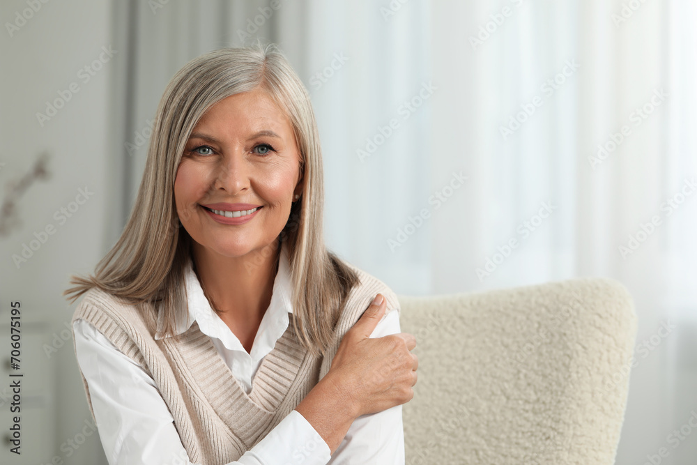Portrait of beautiful middle aged woman at home, space for text Portrait of beautiful middle aged woman at home, space for text