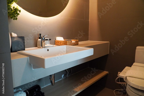 Minimal bathroom with modern furniture,Interior of a modern bathroom with sink and faucet.
