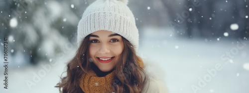 Young Woman Smiling in a Snowy Winter Wonderland Dressed in Warm Clothing