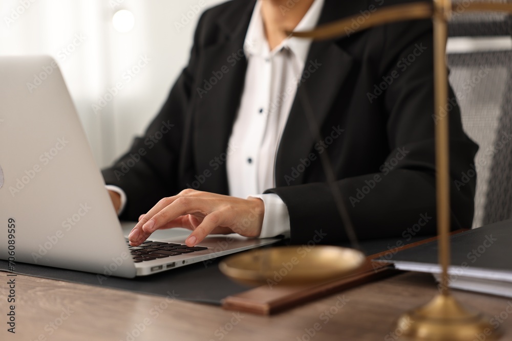 Notary using laptop at workplace in office, closeup Notary using laptop at workplace in office, closeup