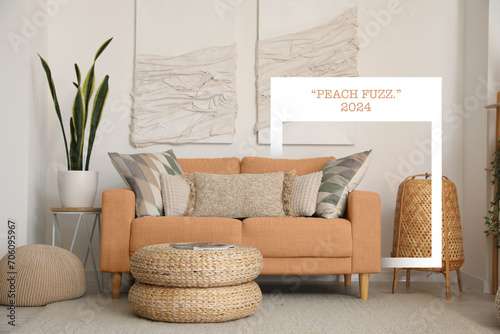 Stylish domestic interior with peach fuzz sofa near light wall photo