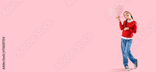 Dreaming little girl with speech bubble on pink background with space for text. Valentine's day celebration
