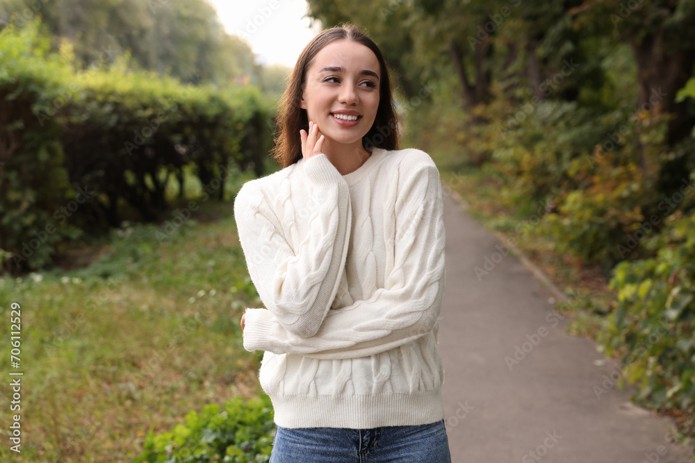 Beautiful young woman in stylish warm sweater outdoors Beautiful young woman in stylish warm sweater outdoors