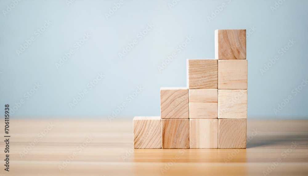 Neatly stacked wooden cubes on table with space for text/infographics symbolize organization, creativity, and customizable information display in a stock photo Neatly stacked wooden cubes on table with space for text/infographics symbolize organization, creativity, and customizable information display in a stock photo