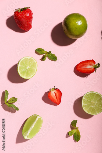 Fototapeta Naklejka Na Ścianę i Meble -  Fresh strawberries with lime and mint on pink background