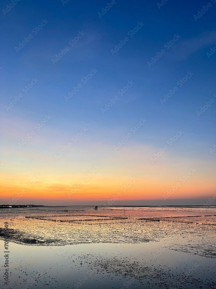 A beautiful sunset sunrise in the sea, silhouette style