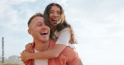 Outdoor, piggy back and couple with smile, holiday and fun with vacation, romance and bonding together. Travel, summer and man carry woman with love, relationship and marriage with date and joyful photo