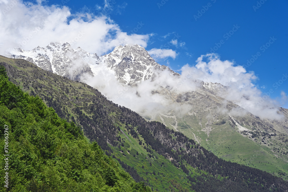 Cloudy mountains of the Digora Gorge in summer