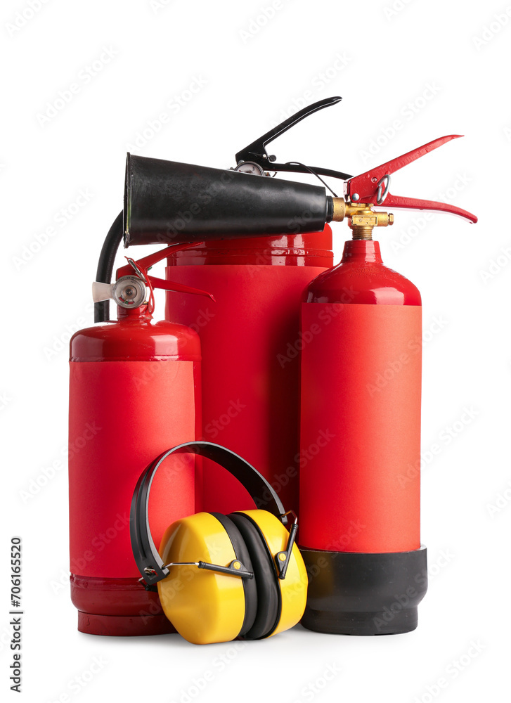 Fire extinguishers and hearing protectors on white background