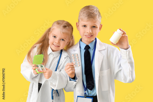 Cute little doctors with pi...