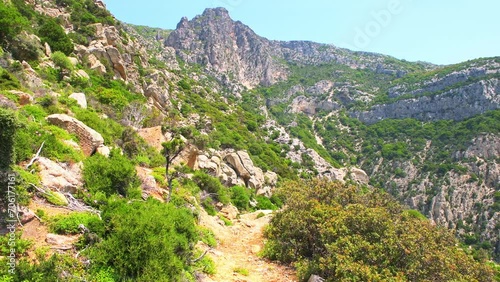 Hiking trail at Magganitis village on Ikaria island, Greece Greek longevity blue zone with landscape nature view to St Elijah church photo