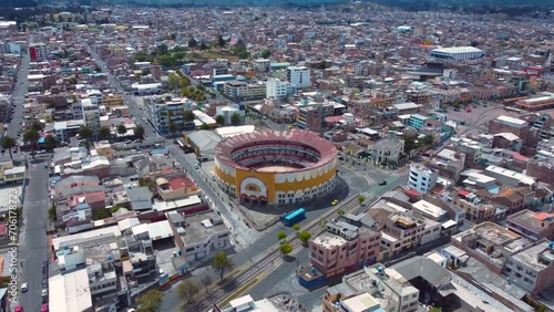 Cityscape with ancient bullfighting arena in Ecuador_drone shot photo
