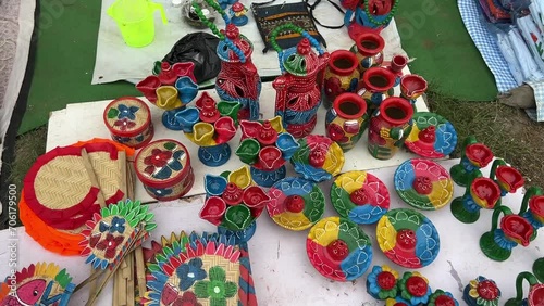 handmade clay diyas and jute fans displayed at an exhibition in Purulia, India photo