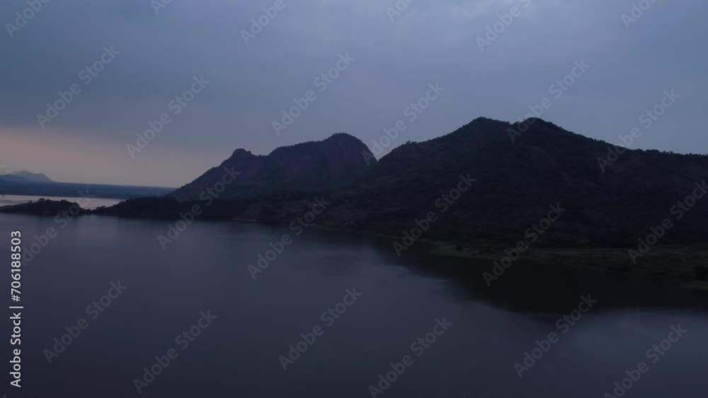 Scenic drone shot of Palar Dam Reservoir at sunset under overcast sky, Tamil Nadu, India Scenic drone shot of Palar Dam Reservoir at sunset under overcast sky, Tamil Nadu, India